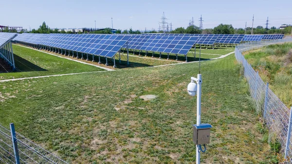 A surveillance camera at a solar power plant. Green energy