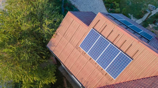 Solar panels on the roof of a house. View from a drone. Green energy
