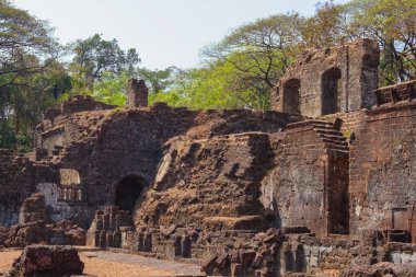 Old GOA, India - February 27, 2024: Ruined brick walls of the Church of St. Augustine. Ancient architecture. Historical monument  clipart