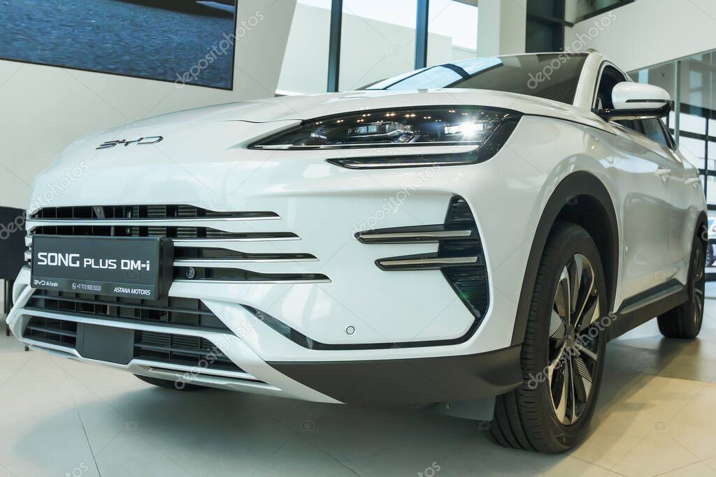 Almaty, Kazakhstan - May 29, 2025: Byd Song plus dm-i white color stands in the car showroom. Chinese car manufacturer