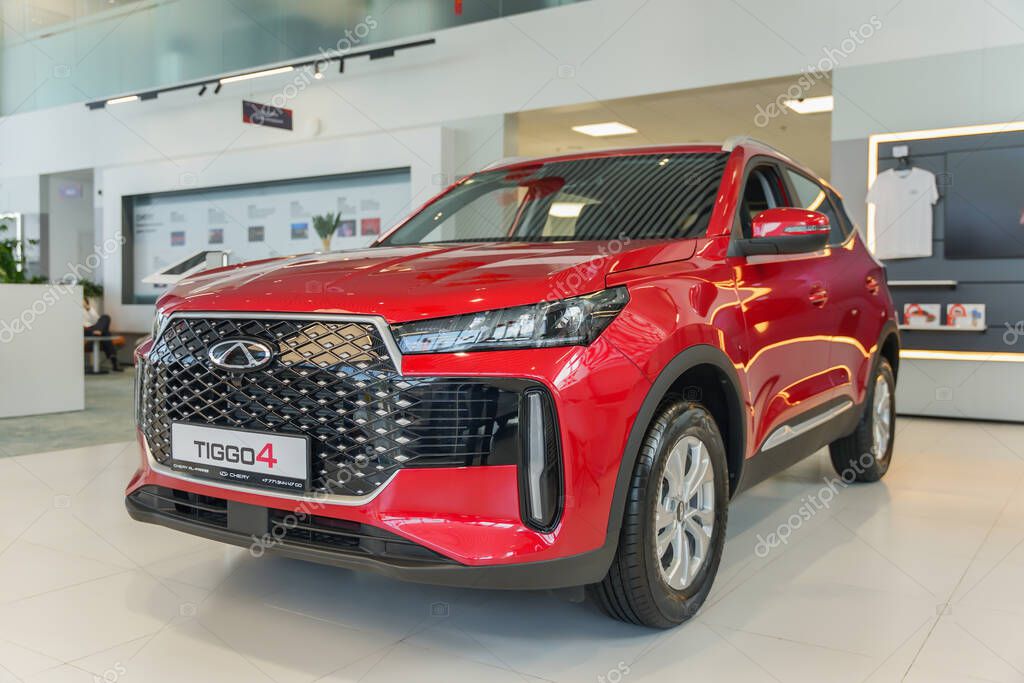 Almaty, Kazakhstan - May 29, 2025: Chery Tiggo 4 red in the showroom. Chinese automobile manufacturing company