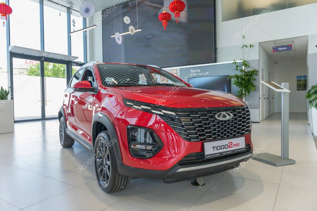 Almaty, Kazakhstan - May 29, 2025: Chery Tiggo 2 pro red color in the showroom. Chinese automobile manufacturing company