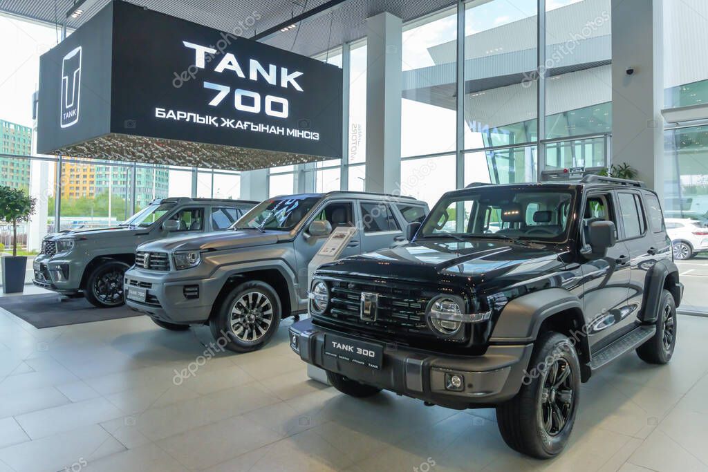 Almaty, Kazakhstan - May 29, 2025: Tank cars line up in a showroom. Chinese car brand