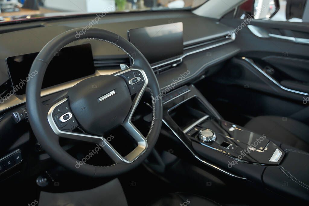 Almaty, Kazakhstan - May 29, 2025: Steering wheel in black leather interior of Haval car. Chinese car brand