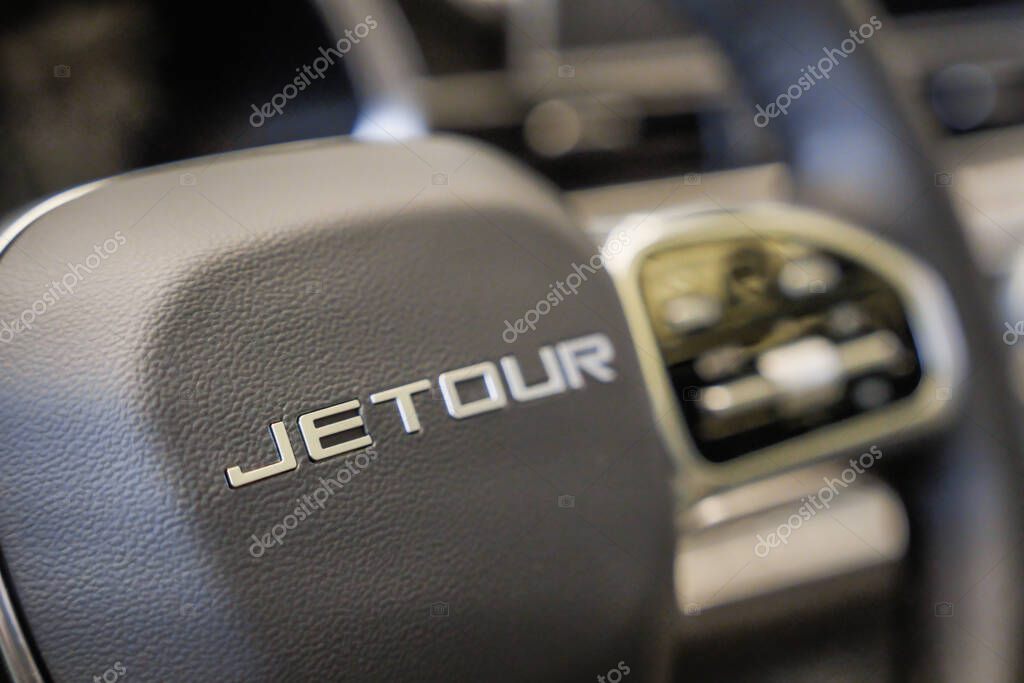 Almaty, Kazakhstan - June 11, 2025: Jetour car emblem on steering wheel. Chinese automaker