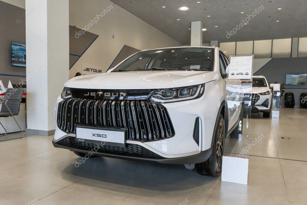 Almaty, Kazakhstan - June 11, 2025: White Jetour X50 car in a showroom. Chinese automaker