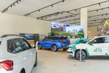 Almaty, Kazakhstan - June 11, 2025: Cars inside the Skoda car dealership. Retail trade in the showroom                            