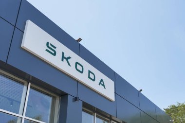 Almaty, Kazakhstan - June 11, 2025: Skoda car brand logo on showroom facade. Retail trade. Official distributor                            
