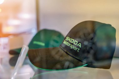 Almaty, Kazakhstan - June 11, 2025: Skoda Motosport cap in the store window. Retail trade in the showroom                            