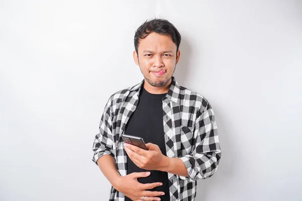 Photo Hungry Excited Young Man Holding His Phone Wondering What — Stock Photo, Image
