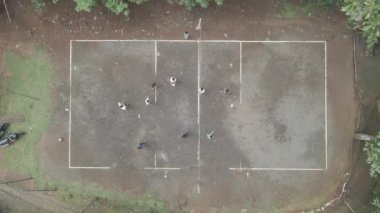 Aerial top down of traditional volley ball in sand field
