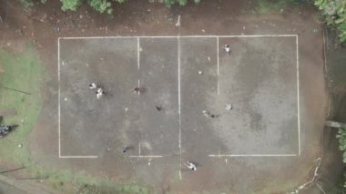 Aerial top down of traditional volley ball in sand field