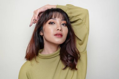 A beauty cheerful face of Asian young model wearing green top. Skincare beauty facial treatment, spa, female health concept.