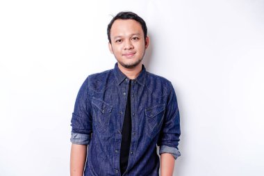 A portrait of a smiling Asian man dressed in a blue shirt, isolated by white background