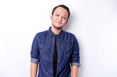 A portrait of a smiling Asian man dressed in a blue shirt, isolated by white background