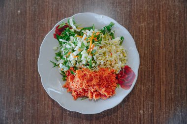 Trancam, Endonezya, Central Java 'dan geleneksel bir yiyecek. Rendelenmiş hindistan ceviziyle karıştırılmış sebzelerden yapılır..