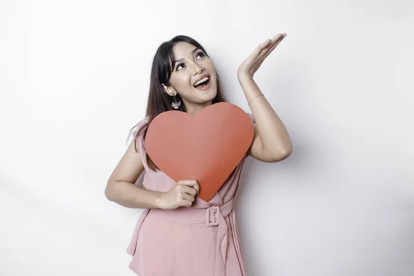 Portrait Smiling Asian Woman Holding Big Red Heart Symbol Pointing — Stock fotografie