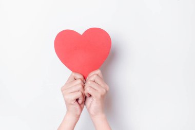 A photo of a red heart shape paper isolated on white background.
