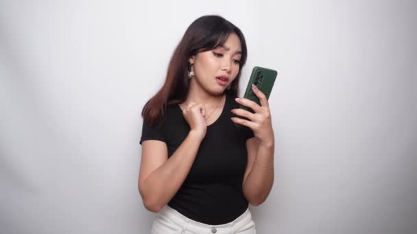 Thoughtful Young Woman Black Shirt Holding Her Chin Phone Hand — Stock videók