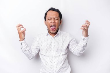 A portrait of an Asian man wearing a white shirt isolated by white background looks depressed