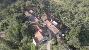 Aerial view of traditional village in the middle of forest in Indonesia