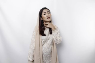 An Asian Muslim woman feels so thirsty because of the hot weather during the summer season while fasting