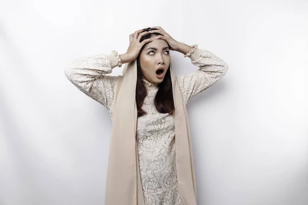 stock image A portrait of an Asian Muslim woman wearing a headscarf isolated by white background looks depressed