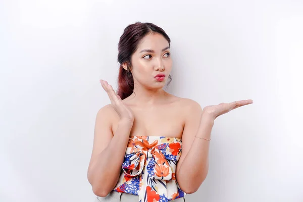 stock image Shocked Asian woman pointing at the copy space on beside her, isolated by white background