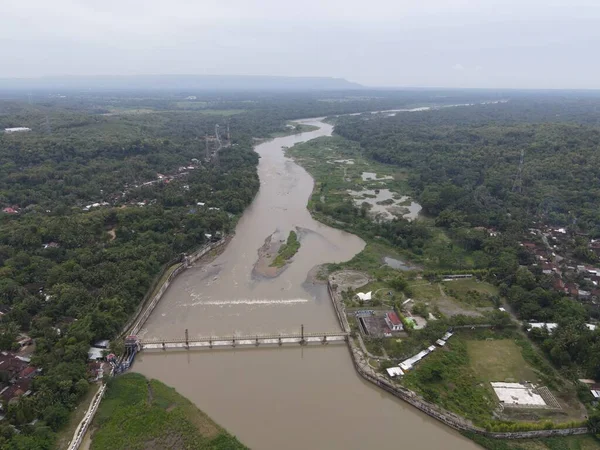 Aerial small dam river in big river Indonesia