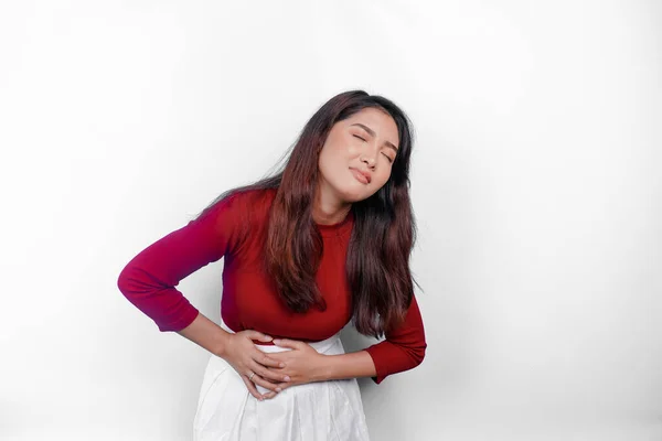 stock image Photo of young unwell sick ill woman hold hand on stomach suffers pain isolated on white background