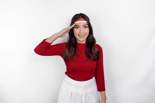 stock image Indonesian woman looking at the camera while give salute with proud gesture