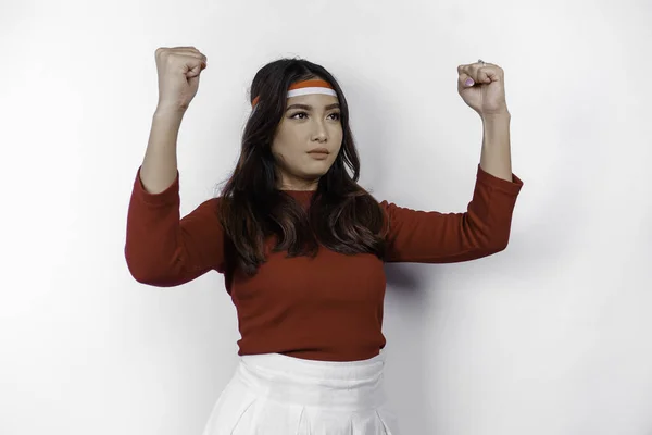 stock image Indonesian woman celebrate Indonesian independence day on 17 August by wearing the Indonesian flag ribbon isolated over white background