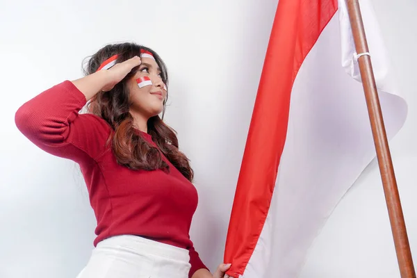 Indonesian Woman Give Salute Proud Gesture While Holding Indonesia Flag — стокове фото