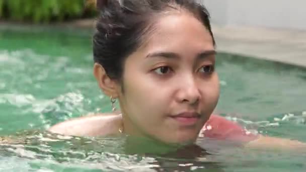 Happy Young Asian Woman Wearing Bikini Swimming Luxury Villa Pool Stock Footage