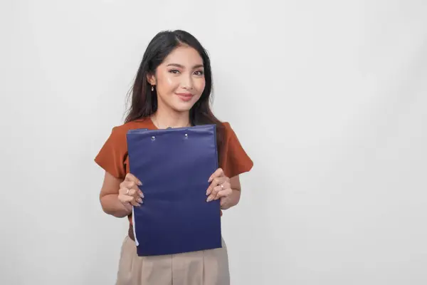 Happy Young Asian Woman Wearing Brown Shirt Smiling While Holding Stock Photo
