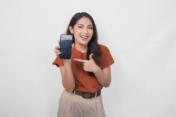 Smiling Asian Woman Showing Pointing Copy Space Her Smartphone Wearing Stok Gambar