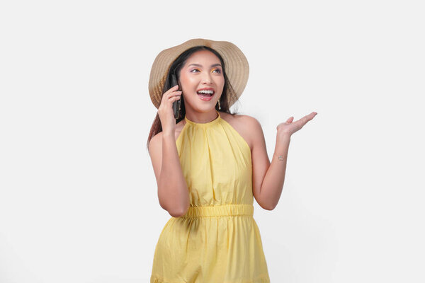 Smiling Young Asian Woman Yellow Dress Straw Hat Talking Cell Stock Image