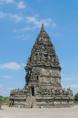 Candi Siwa or Shiva in Prambanan temple complex, Yogyakarta, Indonesia with clear sky nature background, holiday and travel concept.