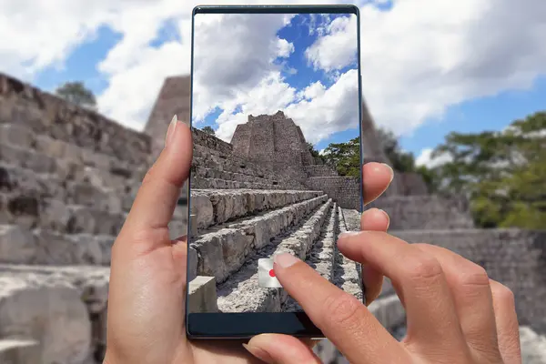 Taking photo by mobile phone pyramid in Mexico.