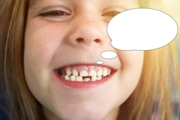 Funny picture with bubble idea portrait of a happy smiling child girl without teeth.