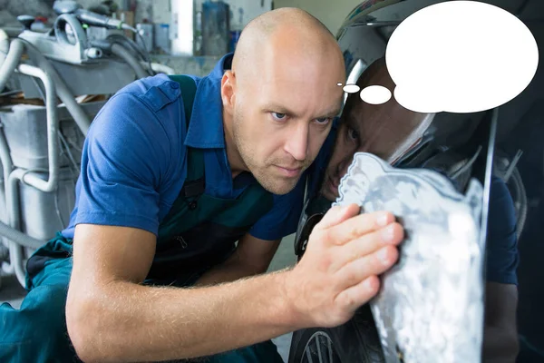 Funny picture with bubble idea bodyworker repair the car bodywork in the car shop.