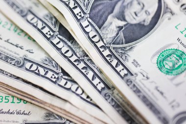 Para geçmişini dolar banknotlarıyla kapatın. Ekonomi ve finans kavramı.