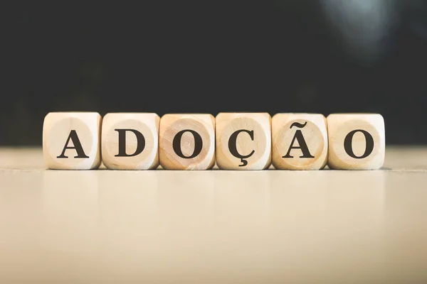 Adopção Inscrição Português Brasileiro Escrita Cubos Madeira Fundo Preto — Fotografia de Stock