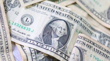 Para geçmişini dolar banknotlarıyla kapatın. Ekonomi ve finans kavramı.