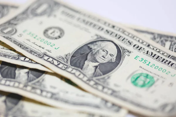 Para geçmişini dolar banknotlarıyla kapatın. Ekonomi ve finans kavramı.