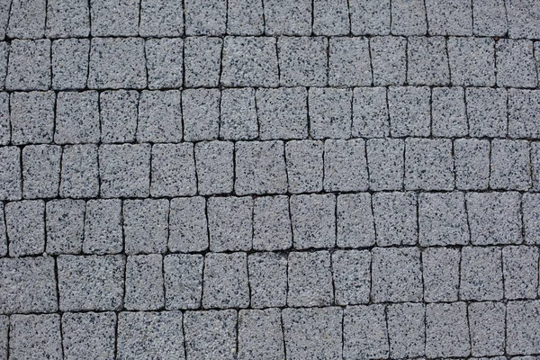 摘要背景 旧鹅卵石铺面特写 正方形纹理图案 花岗岩路面 立面石材质感 — 图库照片
