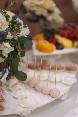 Delicious sweet buffet with cupcakes. Sweet holiday buffet with cupcakes and other desserts. Candy Bar. Dessert table for party goodies. Party reception, decorated delicious in the restaurant.