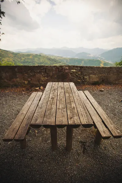 Empty picnic table and chairs in the mountains on a beautiful viewpoint. picnic table at the european mountains. amazing and beautiful place with beautiful view to stay.