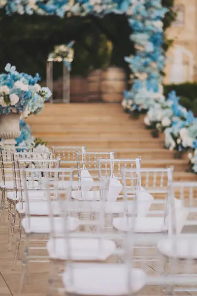 Stock image Decorated ceremonial area outdoors with modern transparent chairs.  wedding ceremony details. chairs for guests at a luxury wedding ceremony