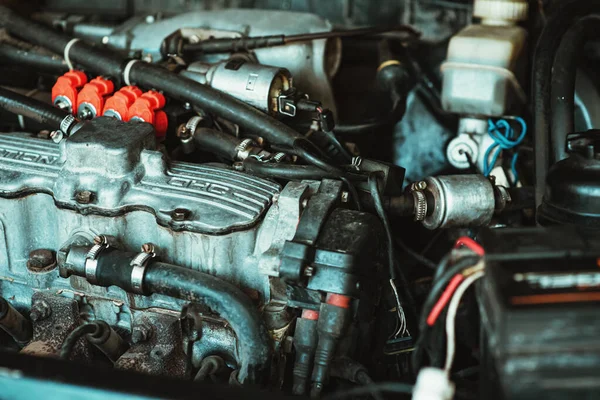 stock image View of the car under the hood. Close-up view of the car. Injector and engine pistons. Car repair. Outdated model of the car